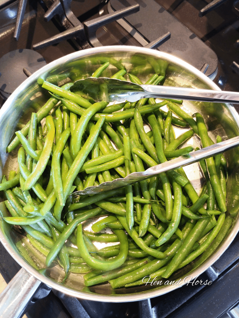 a pan with green beans on stovetop