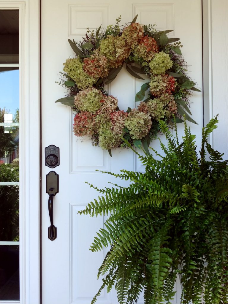 A close up of a door with wreath on it