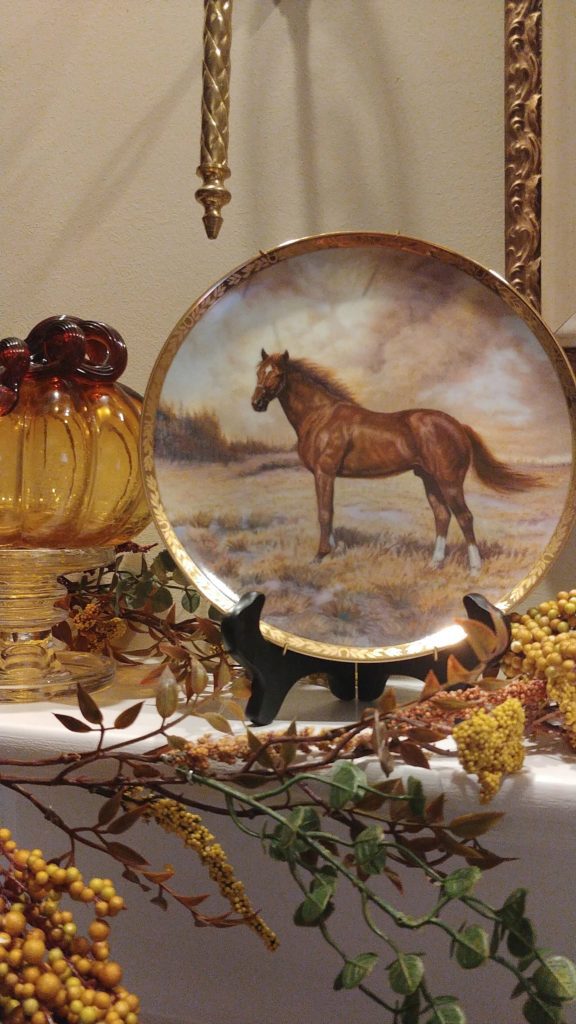 a horse plate on fireplace mantel