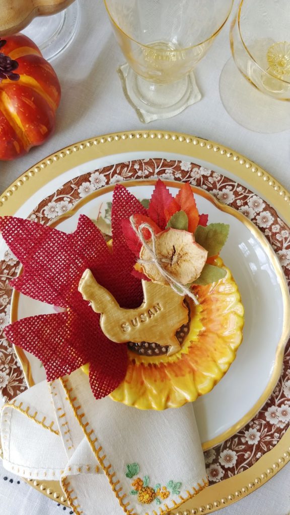 a table topped with a rooster decoration