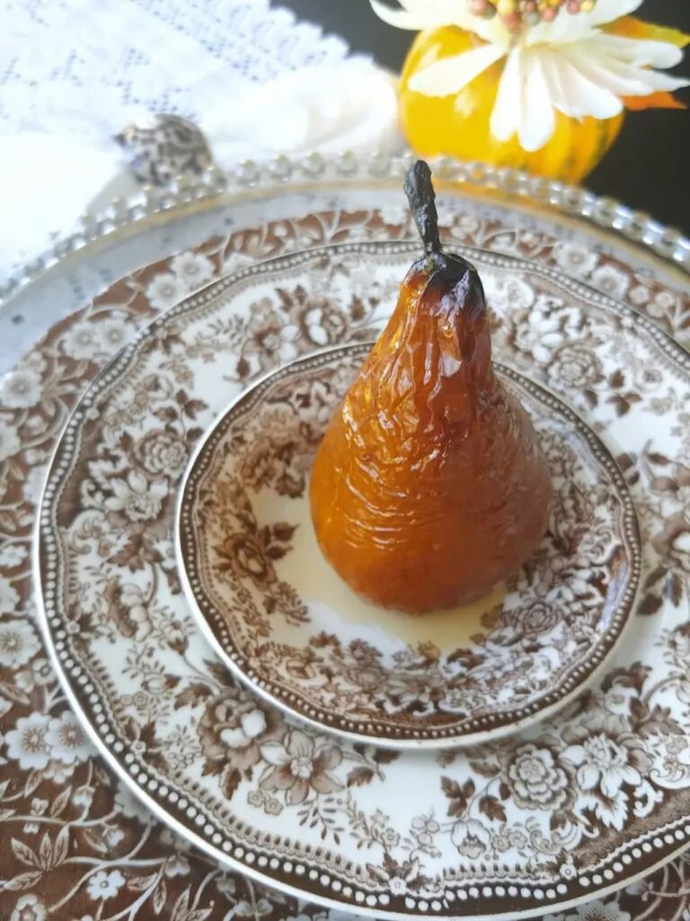 baked pear on vintage brown transferware dish