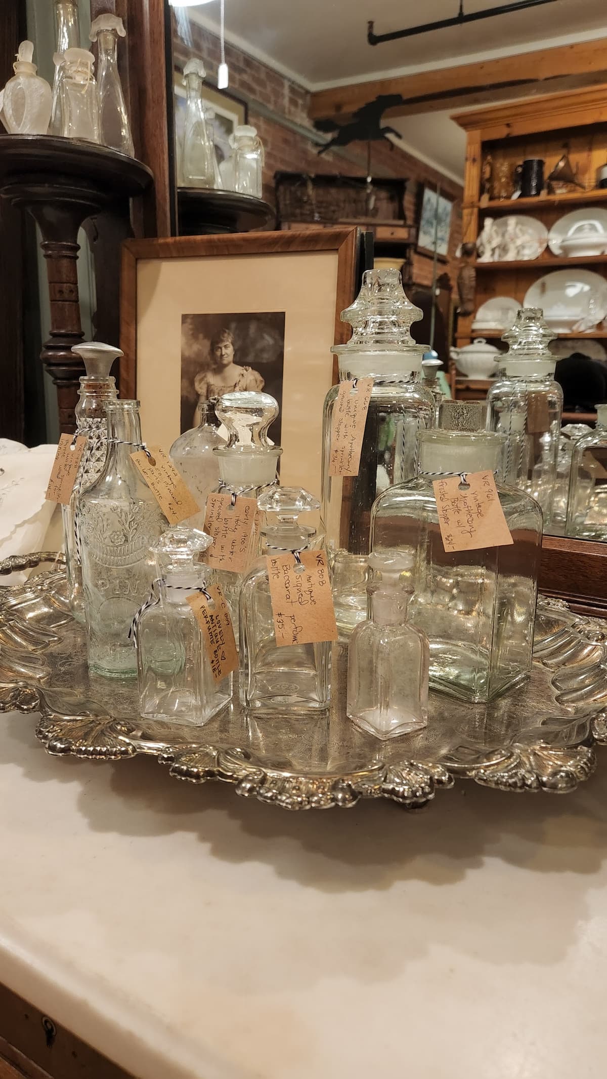 https://www.henandhorsedesign.com/wp-content/uploads/2023/07/estate-sale-vintage-glass-bottles.jpg