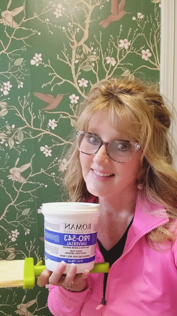 photo of lady with wall paper paste jar in her hand