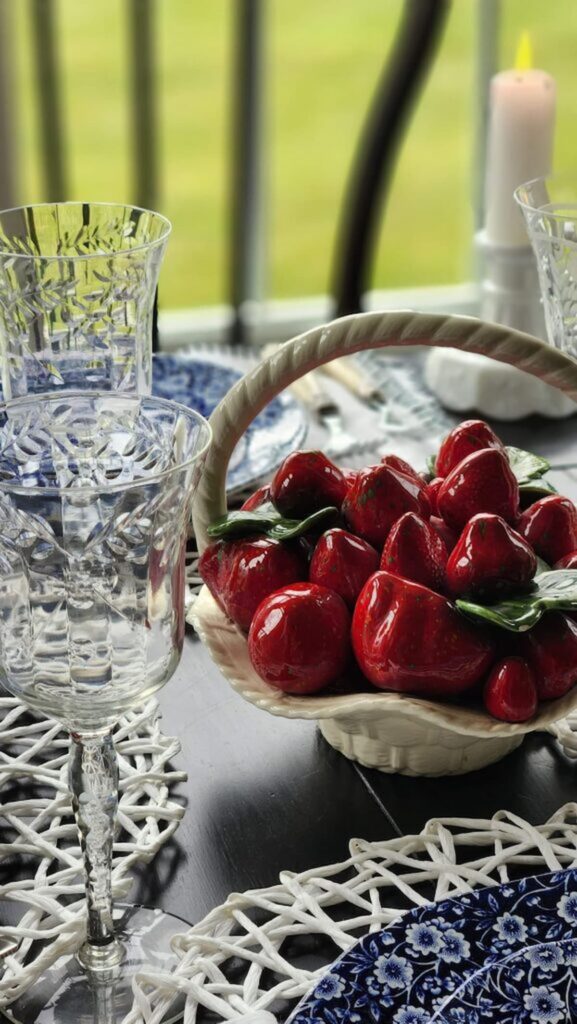 ceramic basket of strawberries and etched stemware glasses