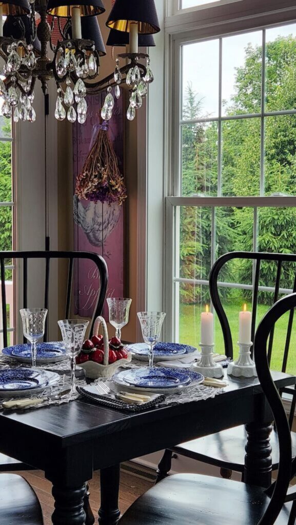 blue and white chintz dishes on table in breakfast room next to window