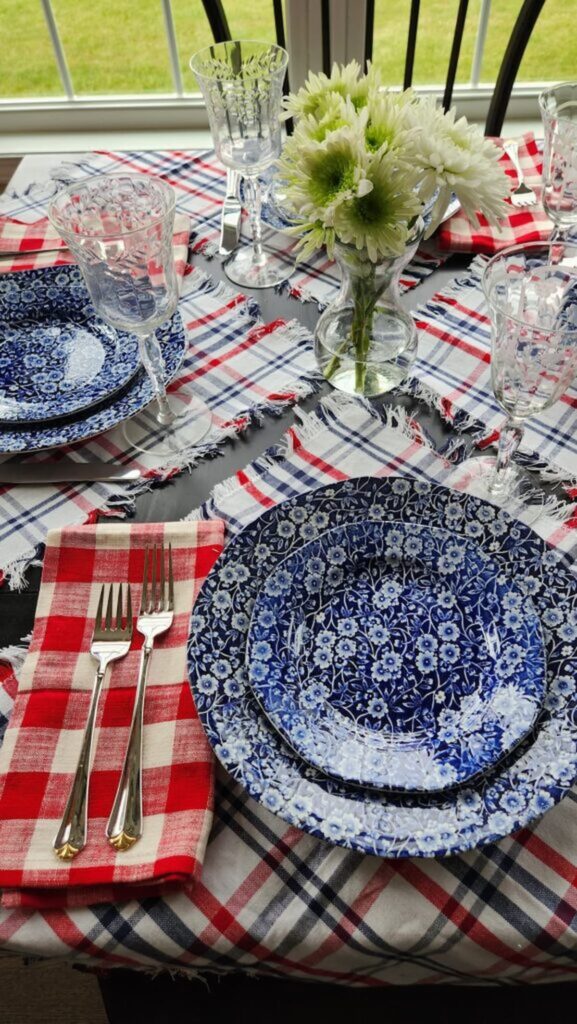 red and blue plaid napkins with blue and white chintz dishes 