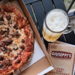 overhead view of giuseppi's pizza and menu