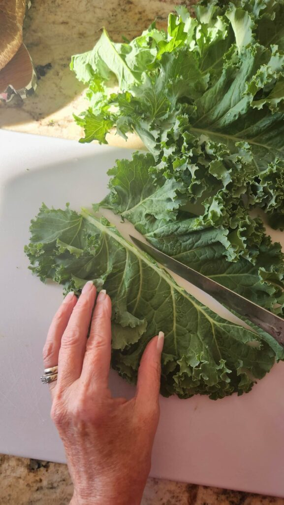 kale being cut and deveined