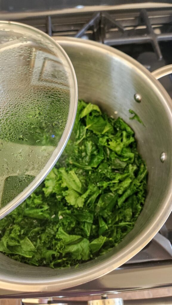 steamed kale in pot on stovetop