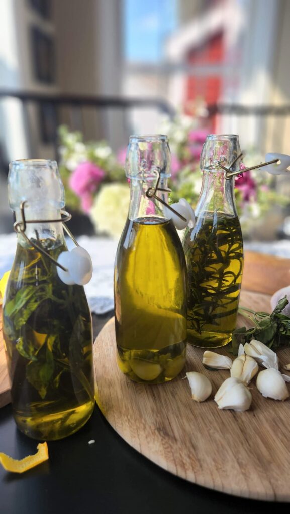 glass bottles with homemade garlic infused oil in them 