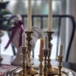 brass candles on silver tray