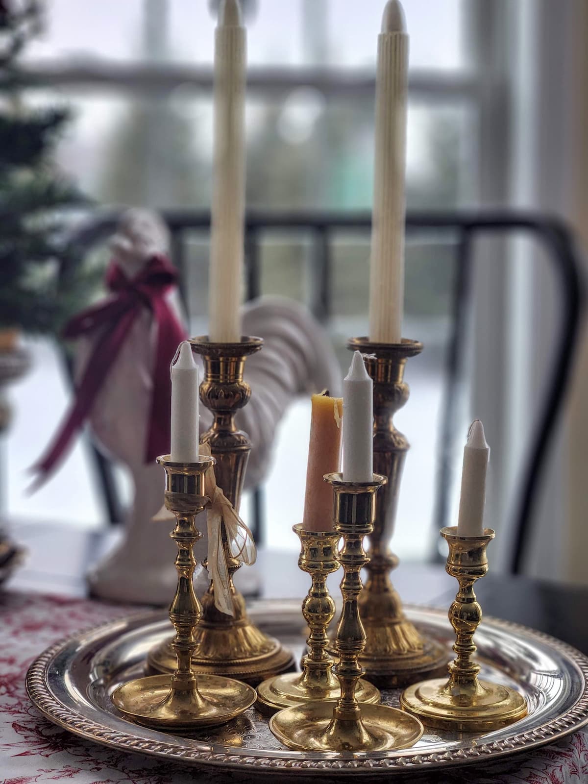 brass candles on silver tray