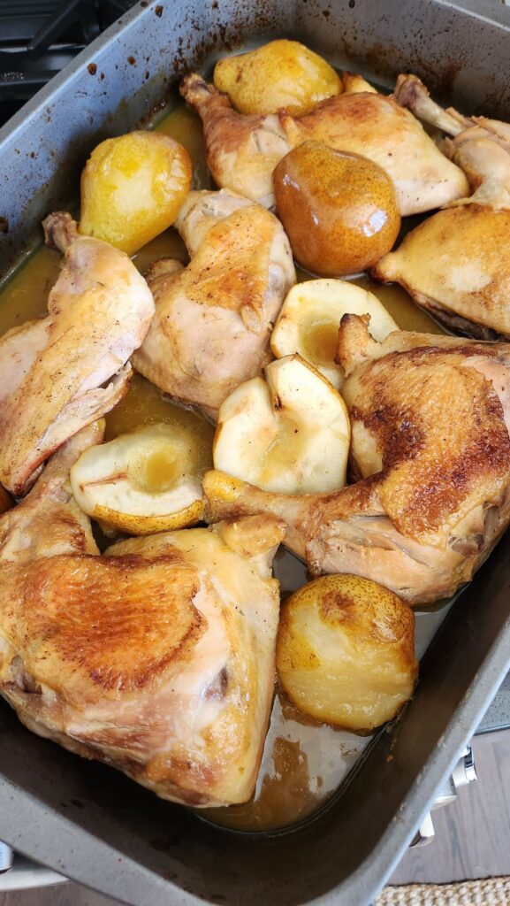 roasted chicken and pears in roasting pan