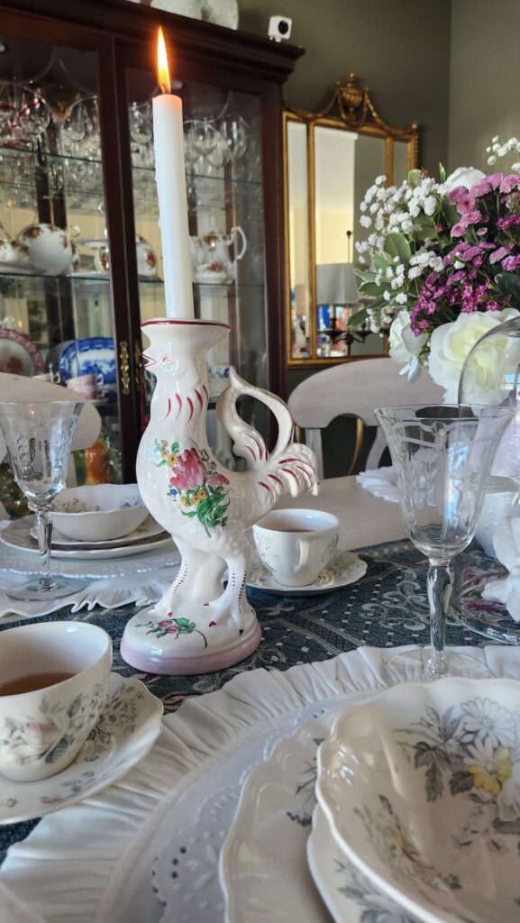 french hen candleholder on table