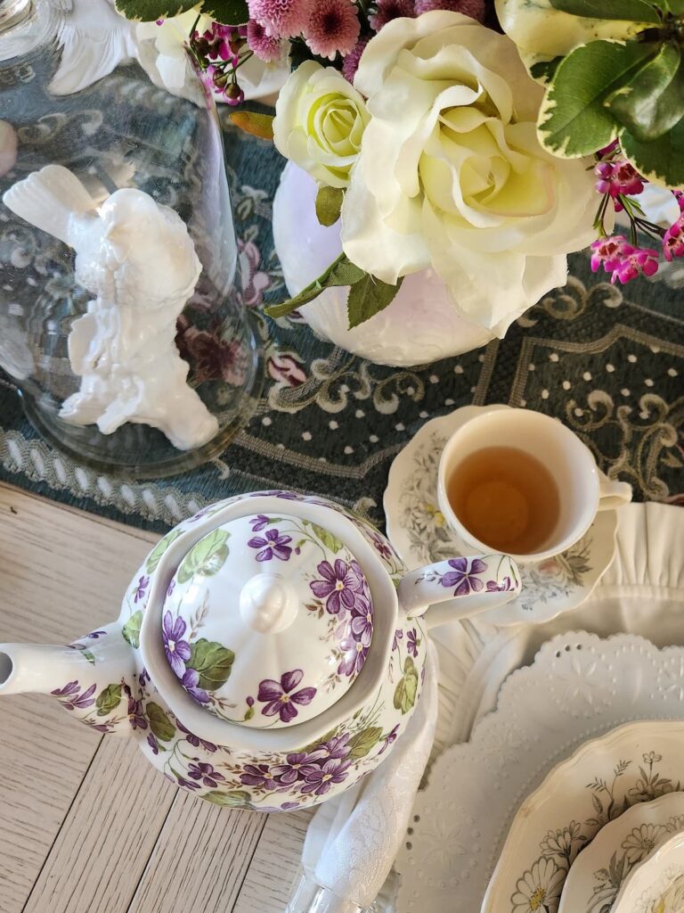 violet teapot on table