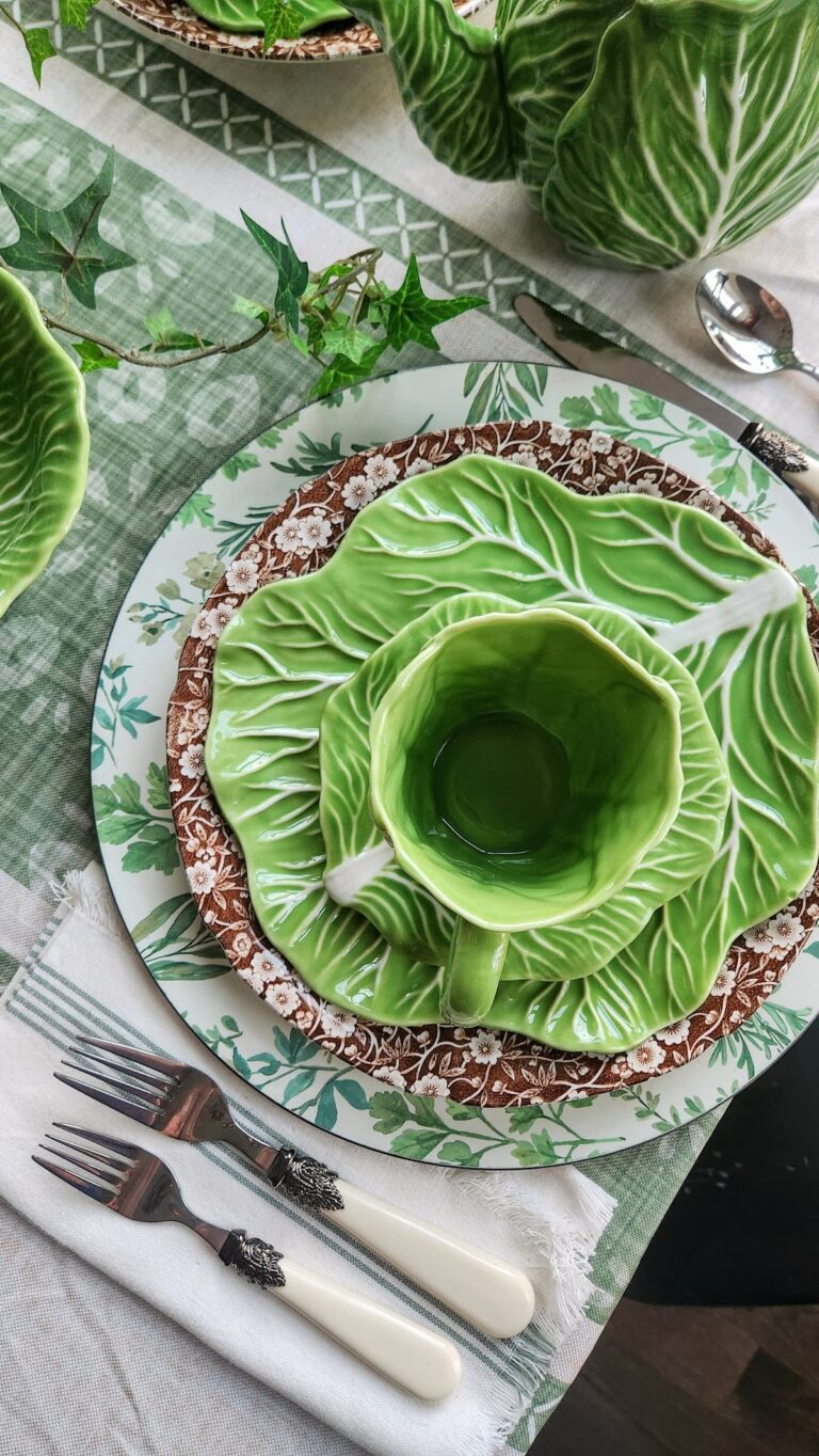 layered cabbage ware dishes on brown calico plate